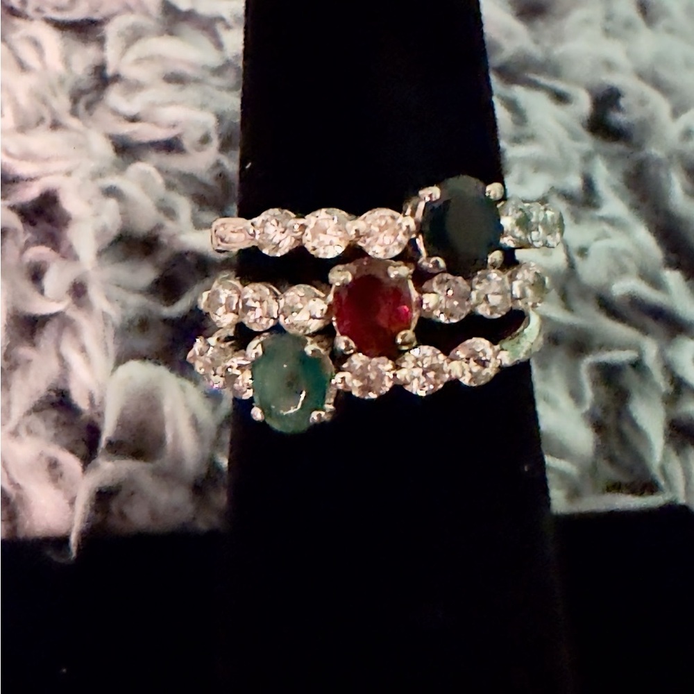 Elegant Sterling Silver trio of emerald, ruby, black onyx and zirconia rings.